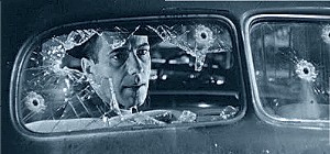 Bogart in bullet-riddled car